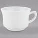 A Tuxton bright white china cup with an embossed rim and a handle.