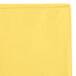 A yellow rectangular plastic table cover in a clear plastic bag with a white zipper.