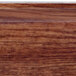 A close up of a wood grain on a Cambro Country Oak Camtray.