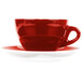 A close-up of a CAC Venice red coffee cup and saucer with a white background.