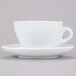 A CAC Venice white cup and saucer on a white surface.