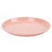 A dark peach Cambro low profile round fiberglass tray with a small rim on a white background.