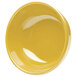 A yellow Elite Global Solutions melamine bowl on a white background.