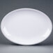 A white oval plate with black trim.