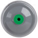 A grey cylinder with a green top and black circle.