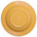 A yellow melamine bowl with a round center.