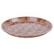A brown Cambro round fiberglass tray with a basketweave pattern.