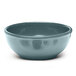 An Elite Global Solutions Urban Naturals melamine bowl with a blue rim.