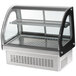 A Vollrath countertop heated display case with a curved glass top.