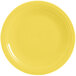 A yellow Fiesta® round chop plate with a white rim.