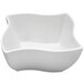 A white Elite Global Solutions square melamine bowl with a curved edge.