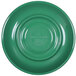 A close-up of a green plate with a circular design and a white rim.