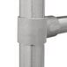 A close-up of a stainless steel Advance Tabco four compartment sink drain pipe.