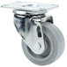 A metal swivel caster with a grey rubber tire.