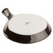 A black and white ceramic Tuxton fry pan server with a white lid.