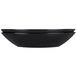 An Elite Global Solutions black melamine oval bowl with a curved edge.