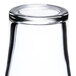 A close up of a Libbey Bell Soda Glass with a lid on top.