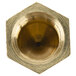 A brass hexagonal nut with a gold tip.