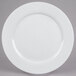A white 10 Strawberry Street porcelain charger plate with a circular edge.