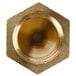 A brass hexagon-shaped natural gas orifice for a countertop griddle.