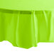 A Fresh Lime Green Creative Converting tablecloth on a table with a white background.