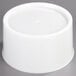 A white plastic Carlisle replacement base for beverage dispensers.