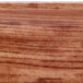 A close up of a wood surface with a wood grain pattern.