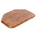 A Cambro Java Teak fiberglass tray with a trapezoid shape on a wooden surface.
