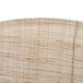 A close-up of a white and brown woven Cambro oval tray.