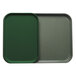A green Cambro tray insert on a grey tray.