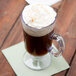 A GET Tritan plastic Irish coffee mug filled with a drink and topped with whipped cream.