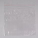A clear plastic LK Packaging resealable sandwich bag with red tape.
