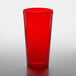 A red GET SAN plastic tumbler on a white surface.