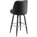 A Lancaster Table & Seating black vinyl bar stool with metal legs.