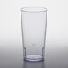 A clear plastic GET tall tumbler on a white surface.