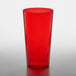 A red GET SAN plastic tumbler on a white surface.