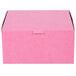 A close up of a pink 8" x 8" x 4" cake box with a lid.