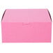 A pink bakery box with a lid.