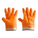 A pair of orange Cordova freezer gloves with white trim and an orange palm.