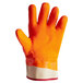 An orange and white San Jamar freezer glove.