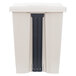 A beige Rubbermaid commercial step-on trash can with black handles.