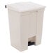 A white Rubbermaid rectangular step-on trash can with a black lid.