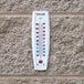 A Taylor wall thermometer showing the temperature.