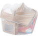 A white plastic trash bag filled with boxes.