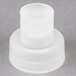 A white plastic cap with a round top.