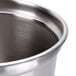 A close-up of a stainless steel Vollrath low profile inset with a lid.