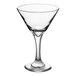 A clear glass martini or cocktail glass with a wide bowl and a long stem.