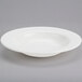A Homer Laughlin Pristine Ameriwhite wide rim china soup bowl in white.