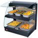 A Hatco countertop food warmer with food on double shelves.