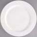 A Tuxton AlumaTux white china plate with a white rim.